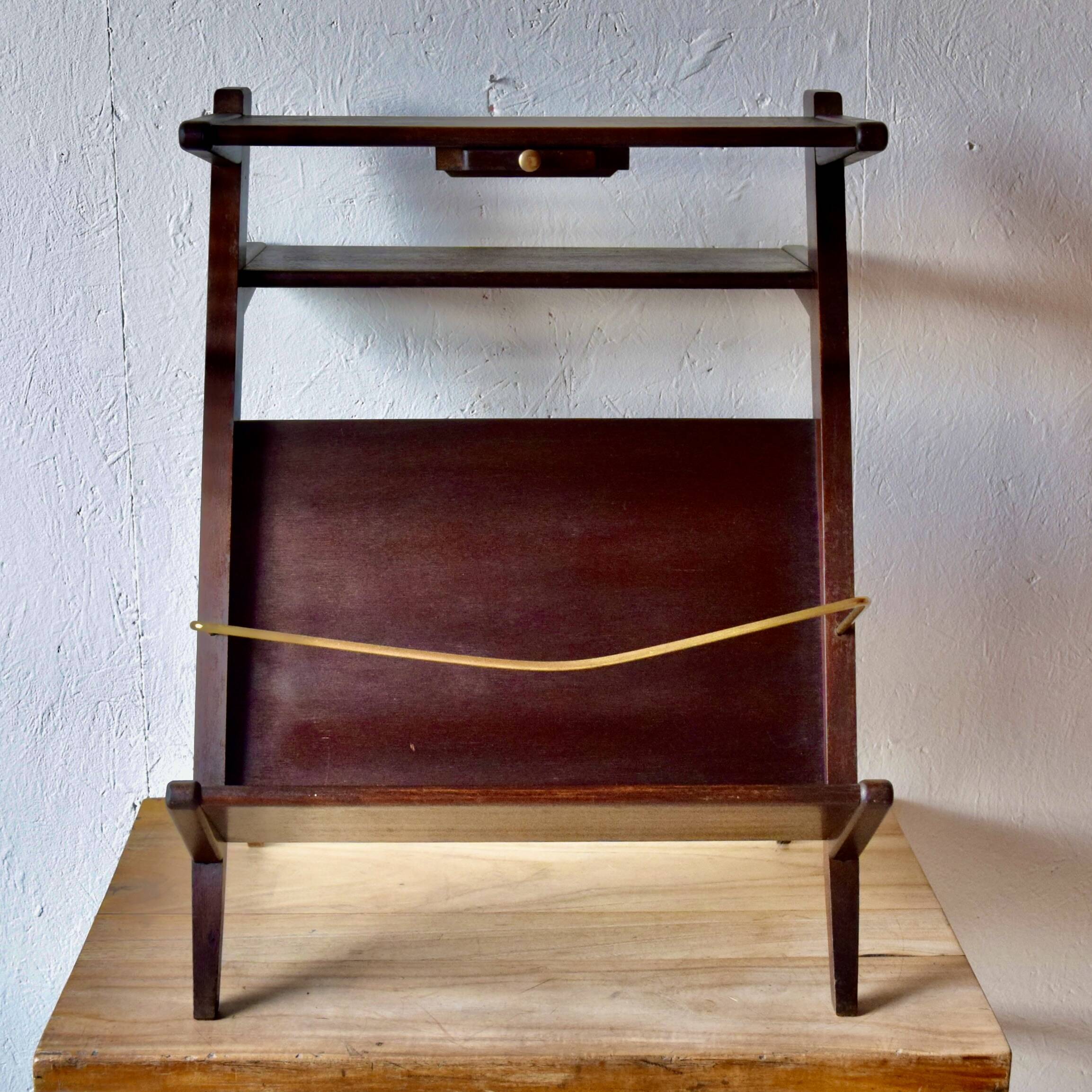 Old Scandinavian style magazine rack in dark wood with integrated brass ashtray