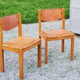 Pair of brutalist chairs in elm and stretched leather with saddle stitching Self publisher