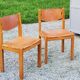 Pair of brutalist chairs in elm and stretched leather with saddle stitching Self publisher