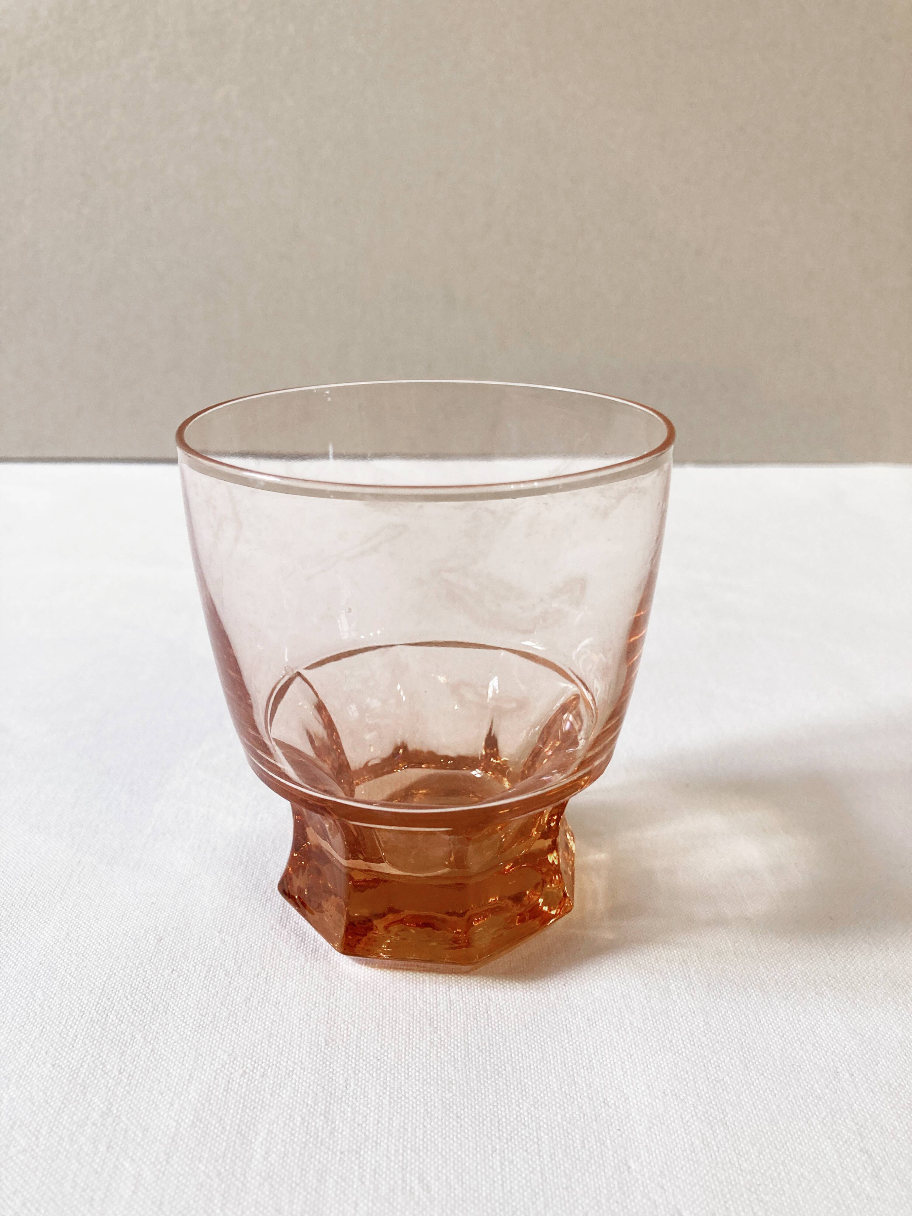 Pitcher and 6 water glasses in pink glass
