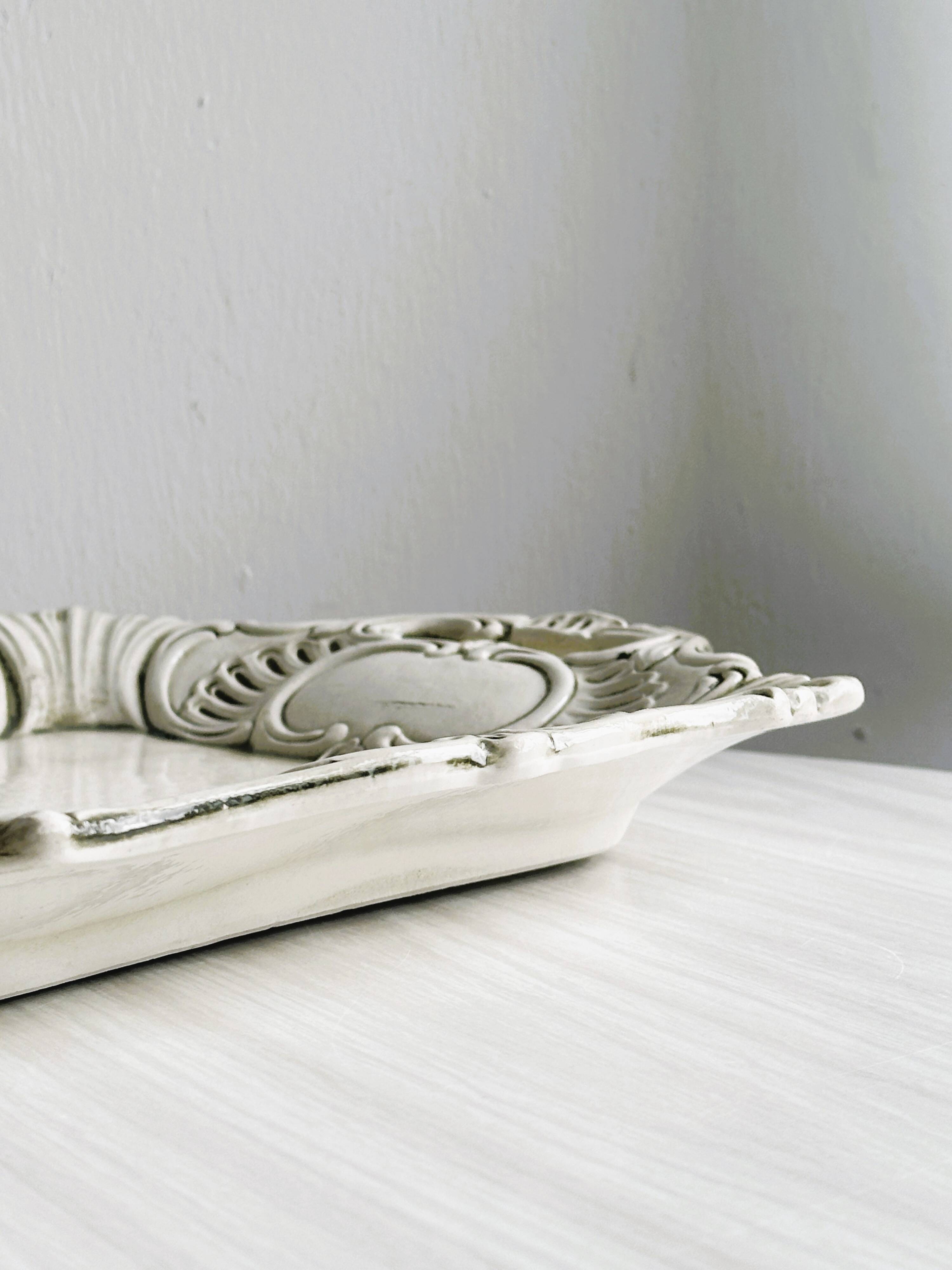 Old white ceramic tray, old dish.