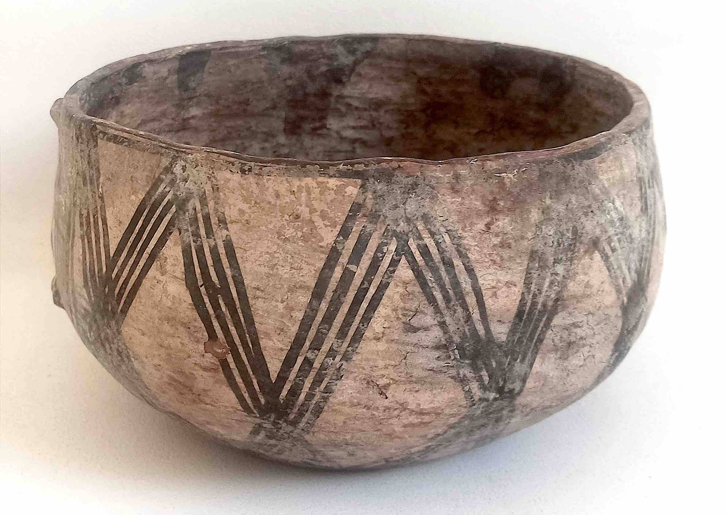 Large ethnic style bowl in orange terracotta, early 20th century