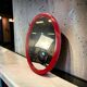Miroir vintage de l'ère spatiale en rouge orange
