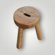 Antique brutalist tripod stool in solid wood