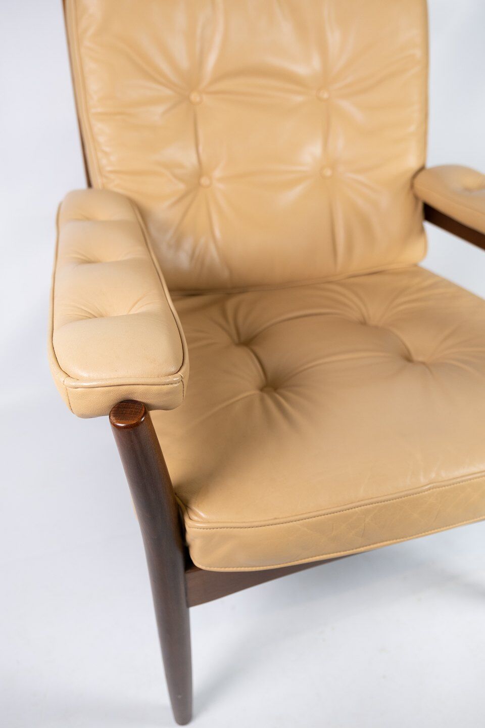 Armchair in dark wood and upholstered with light elegance leather of danish design, 1960s