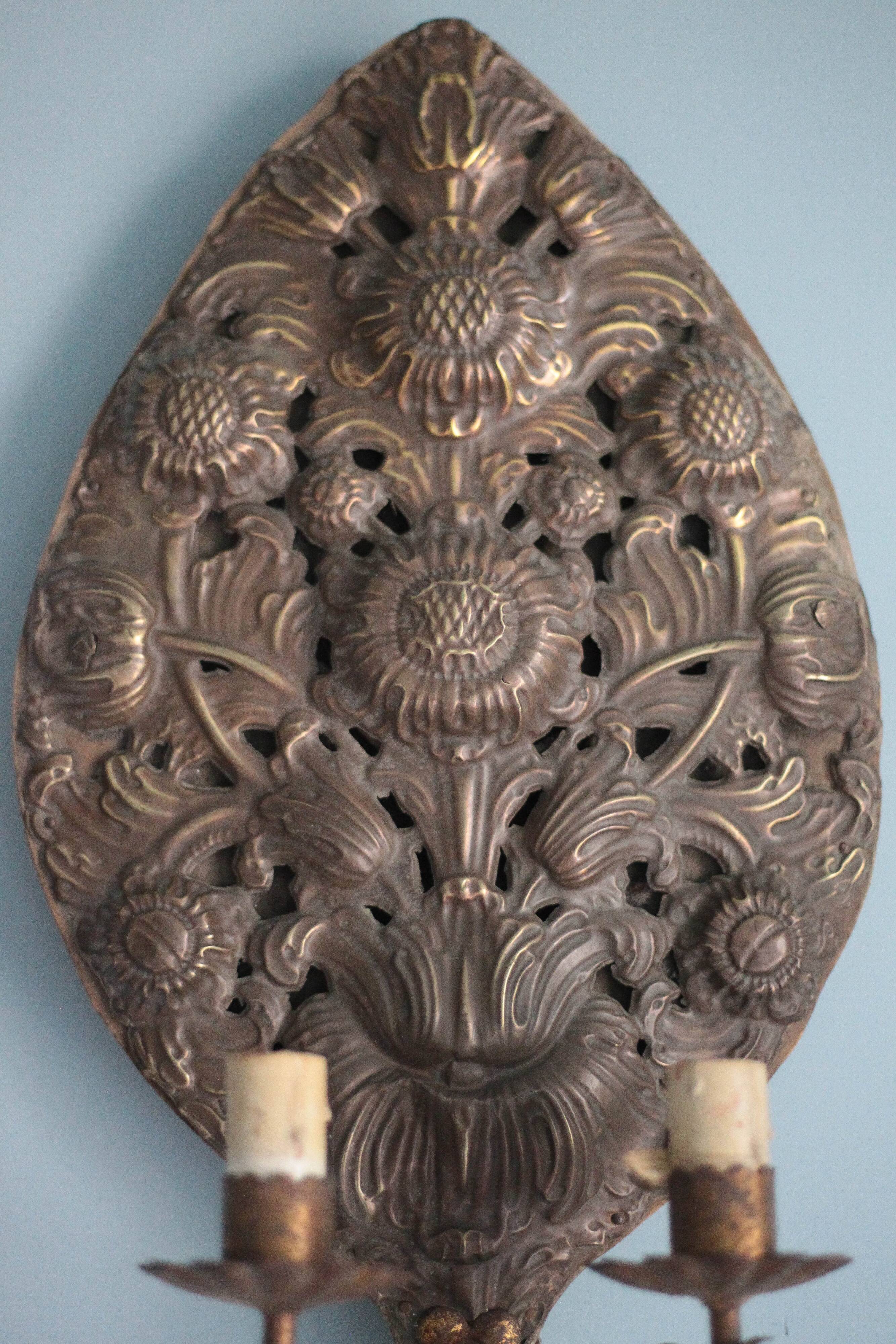 Pair of wall sconces in embossed brass with floral patterns, wall lamp, sconce.