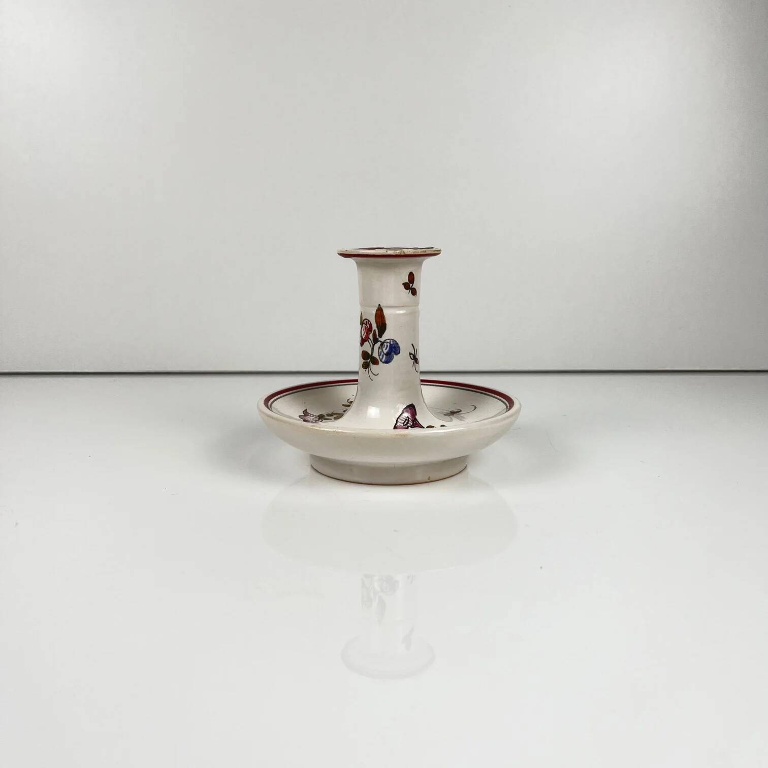 Hand-painted ceramic candlestick, flower pattern.