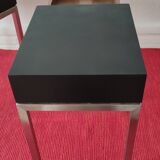 A pair of minimalist bedside tables