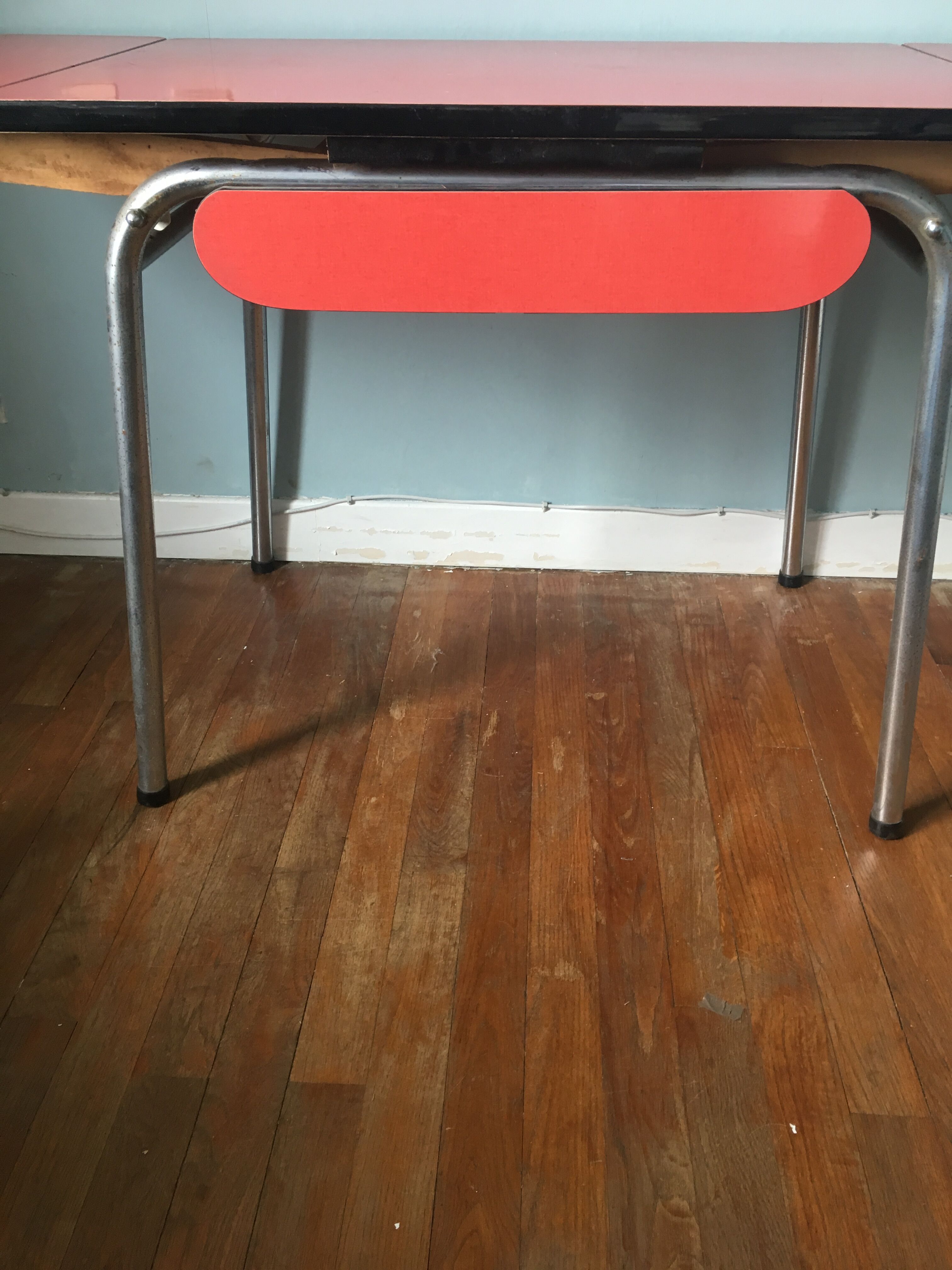 Large table in red formica with extensions + red drawer