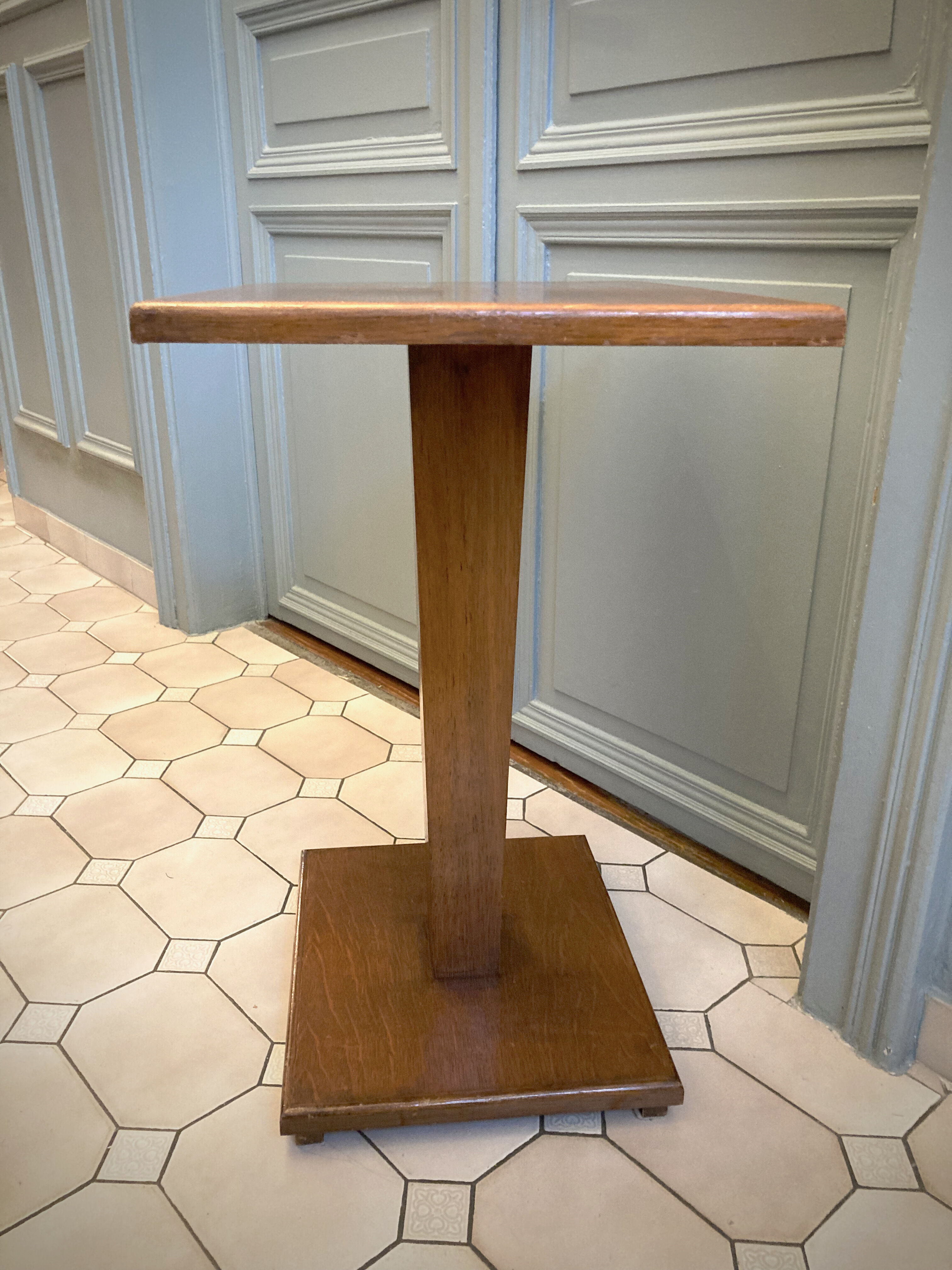 Square pedestal table with central foot 1930
