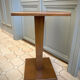 Square pedestal table with central foot 1930