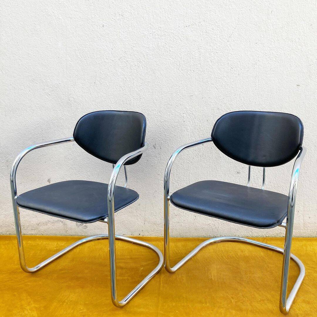 Pair of Effezeta chairs, tubular structure, chrome and black skai