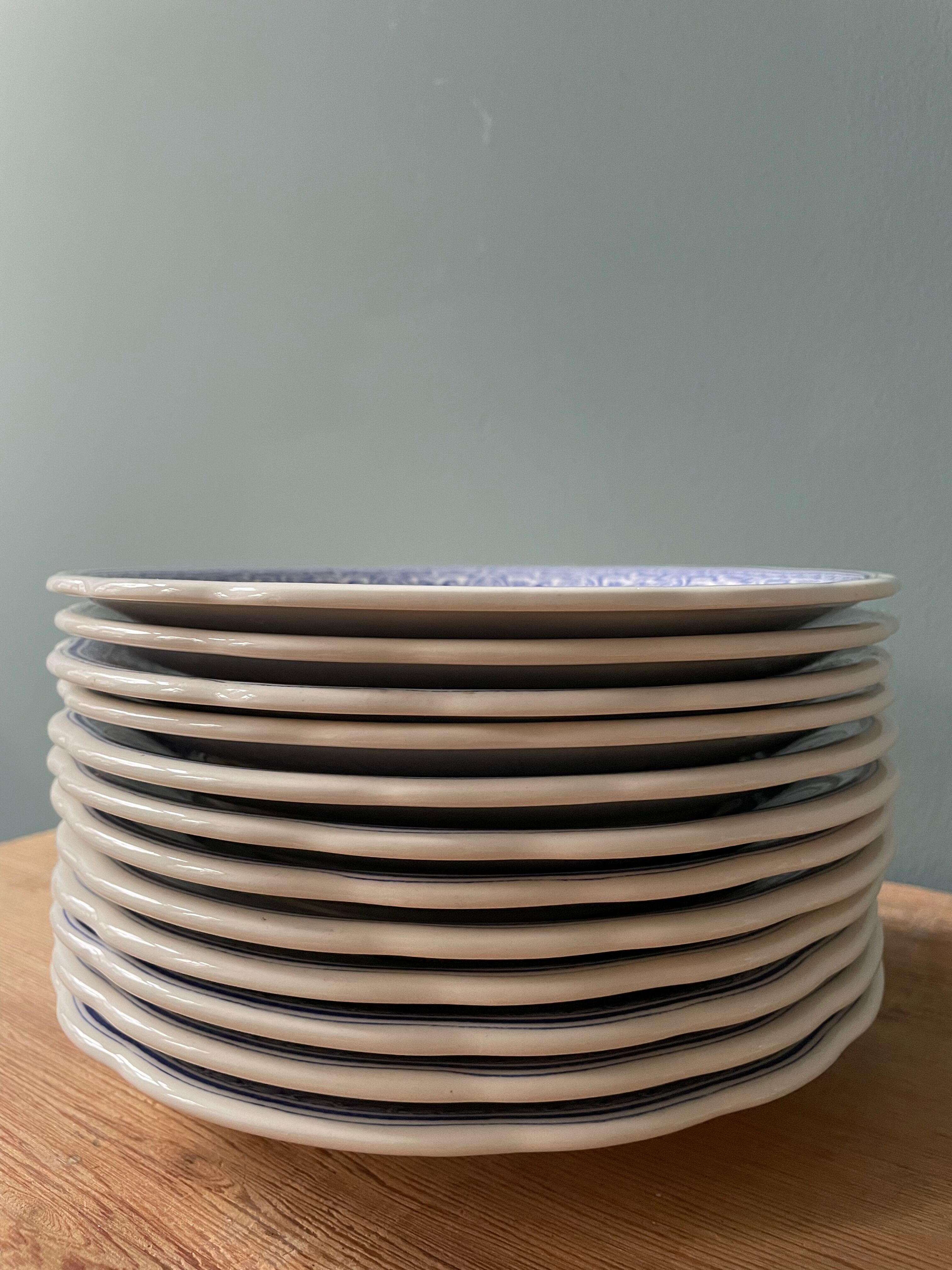 Complete set of 12 talking plates in Gien earthenware