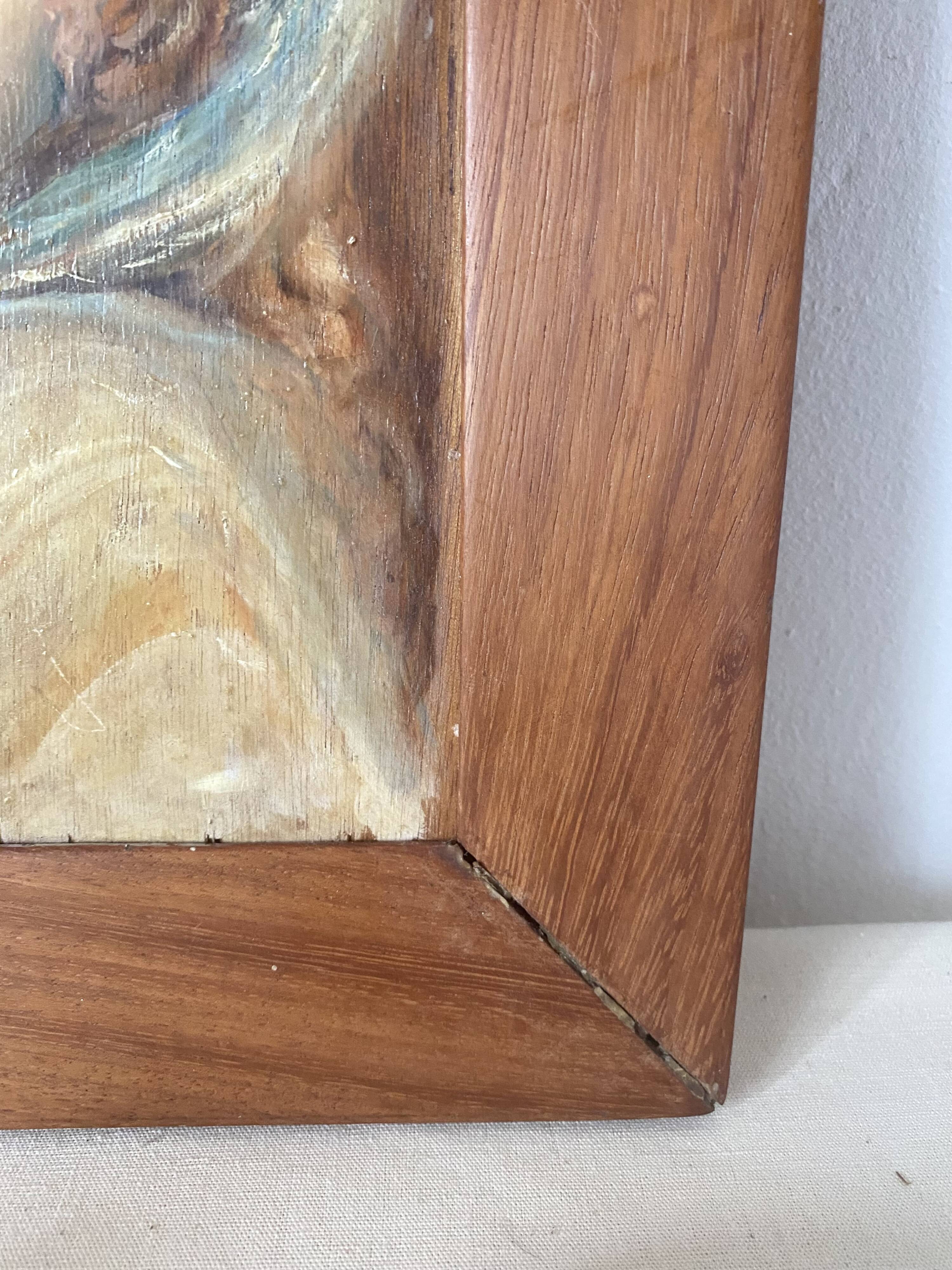 Old oil portrait on wood of a young woman