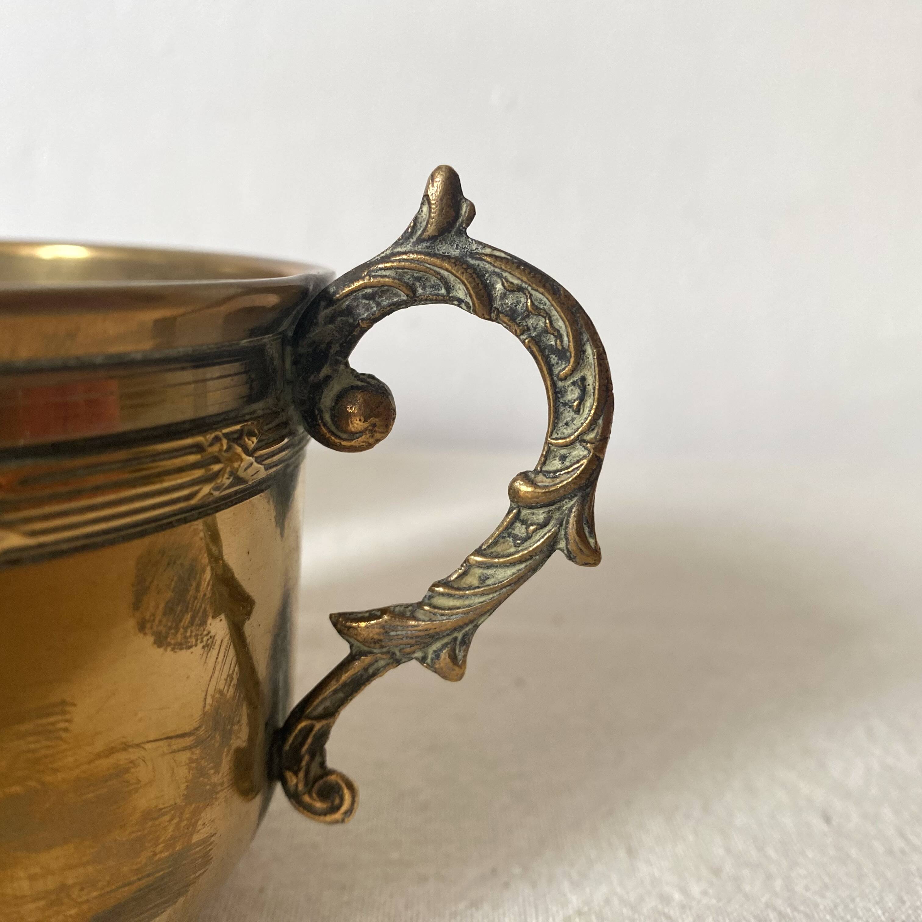 Antique brass cups