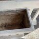 Pair of sculptural cast concrete planters in Off-White, mid-century brutalist style, long and rectangular.