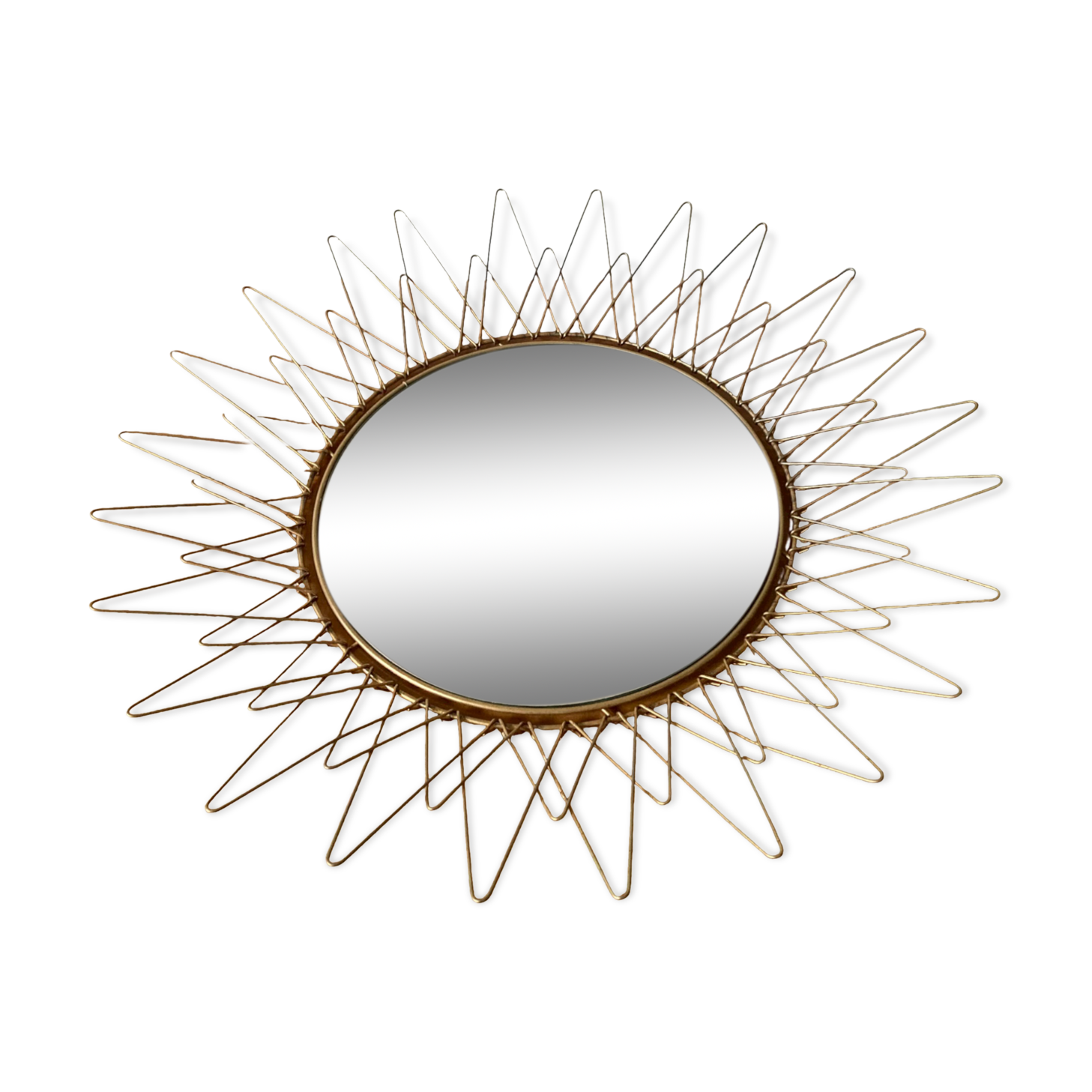 Sun mirror in gilded metal