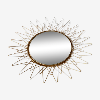 Sun mirror in gilded metal