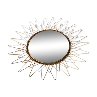 Sun mirror in gilded metal
