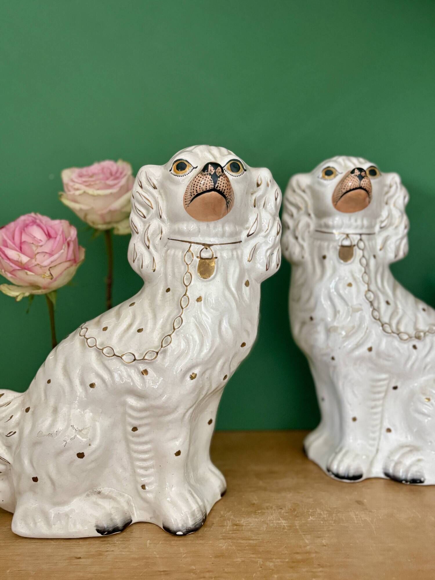 Pair of Staffordshire-type dogs in white and gold ceramic