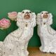 Pair of Staffordshire-type dogs in white and gold ceramic
