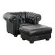 Set of a black cowhide leather Chesterfield armchair and matching ottoman