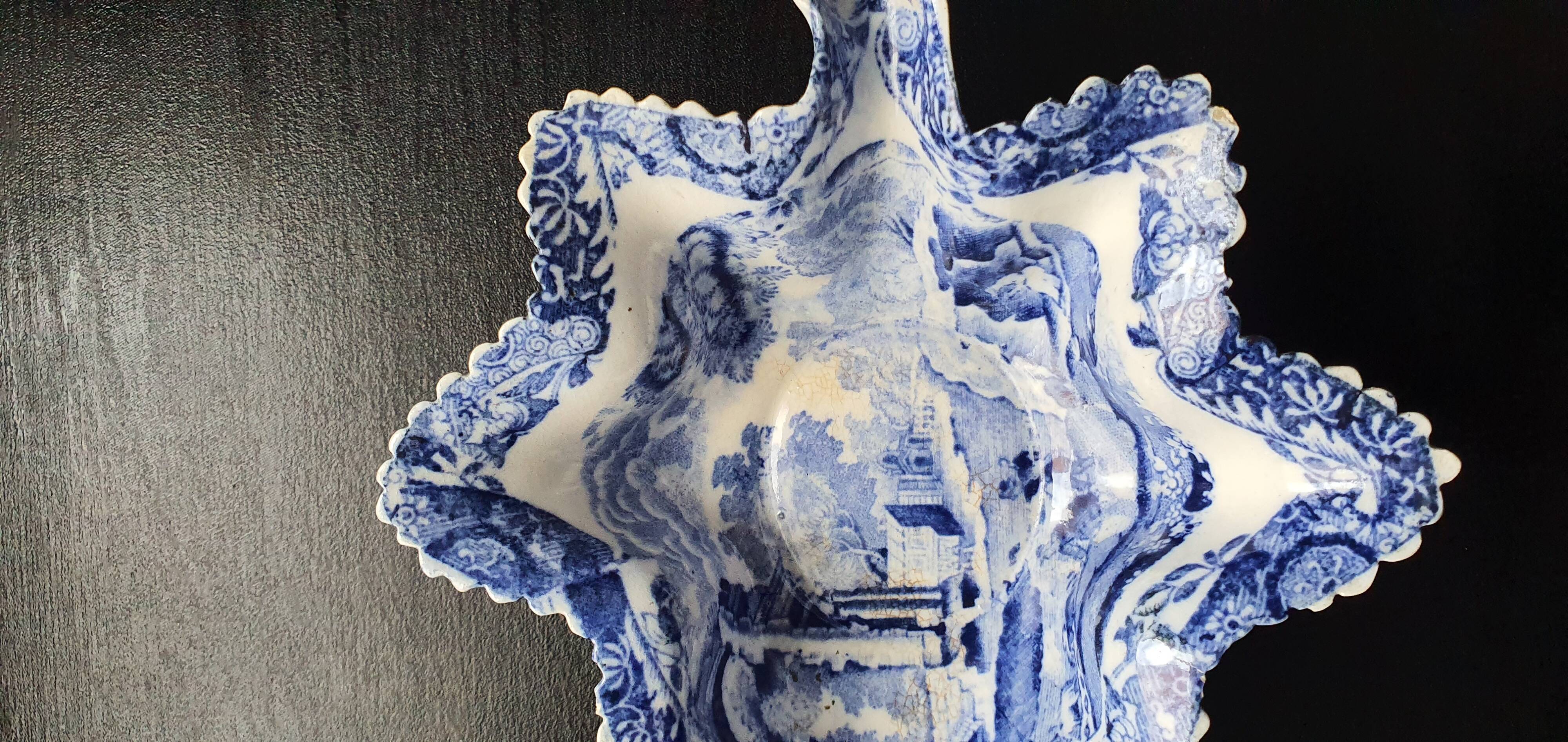 Copeland pickle dish in the shape of a leaf in blue earthenware.