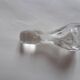 Cut crystal oil bottle with its crystal stopper.