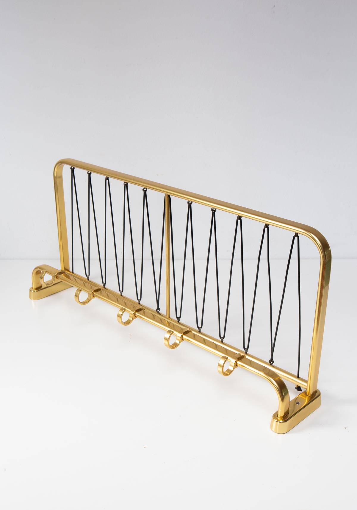 Wall-mounted coat rack with a golden aluminium shelf c. 1960 (62.5 cm)