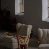 Pair of modern Swedish lounge chairs, shearling sheepskin and elm, 1940s.