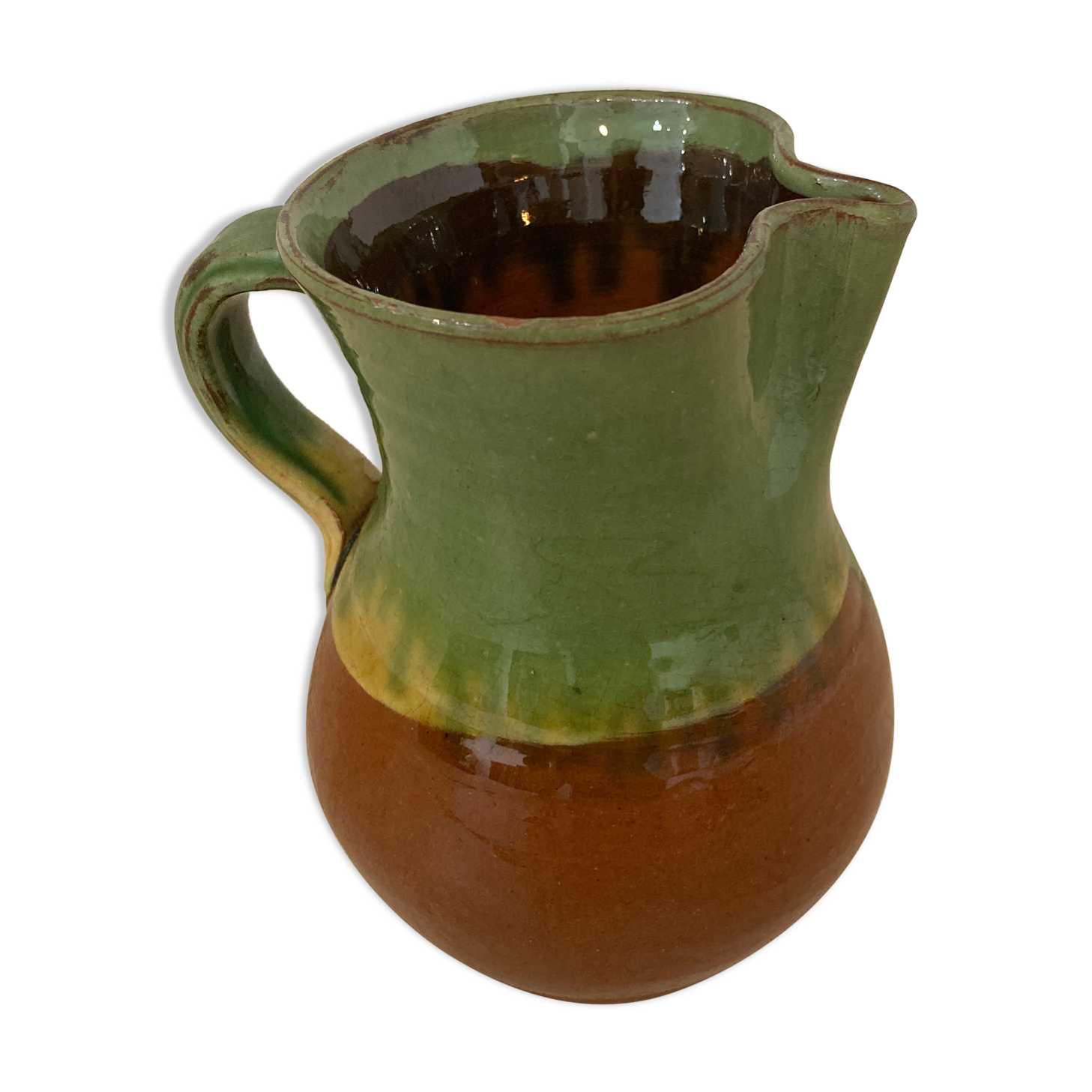 Green and brown ceramic pitcher