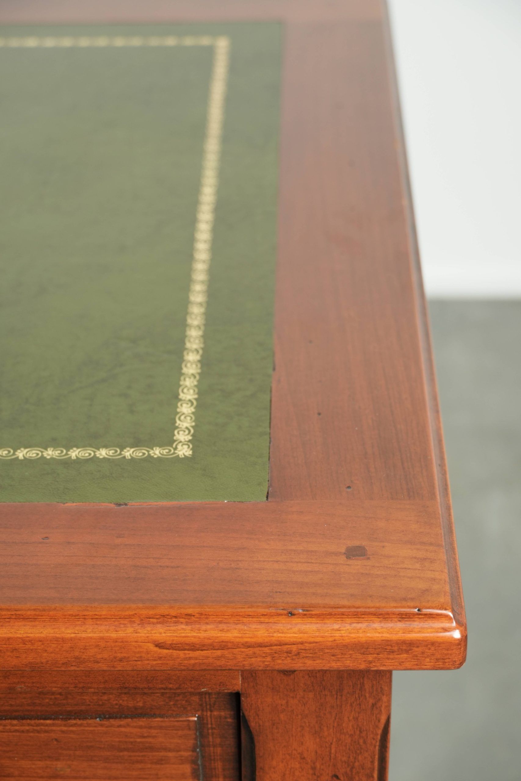 Elegant English style desk with green leather top, gold details and drawers