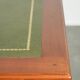 Elegant English style desk with green leather top, gold details and drawers