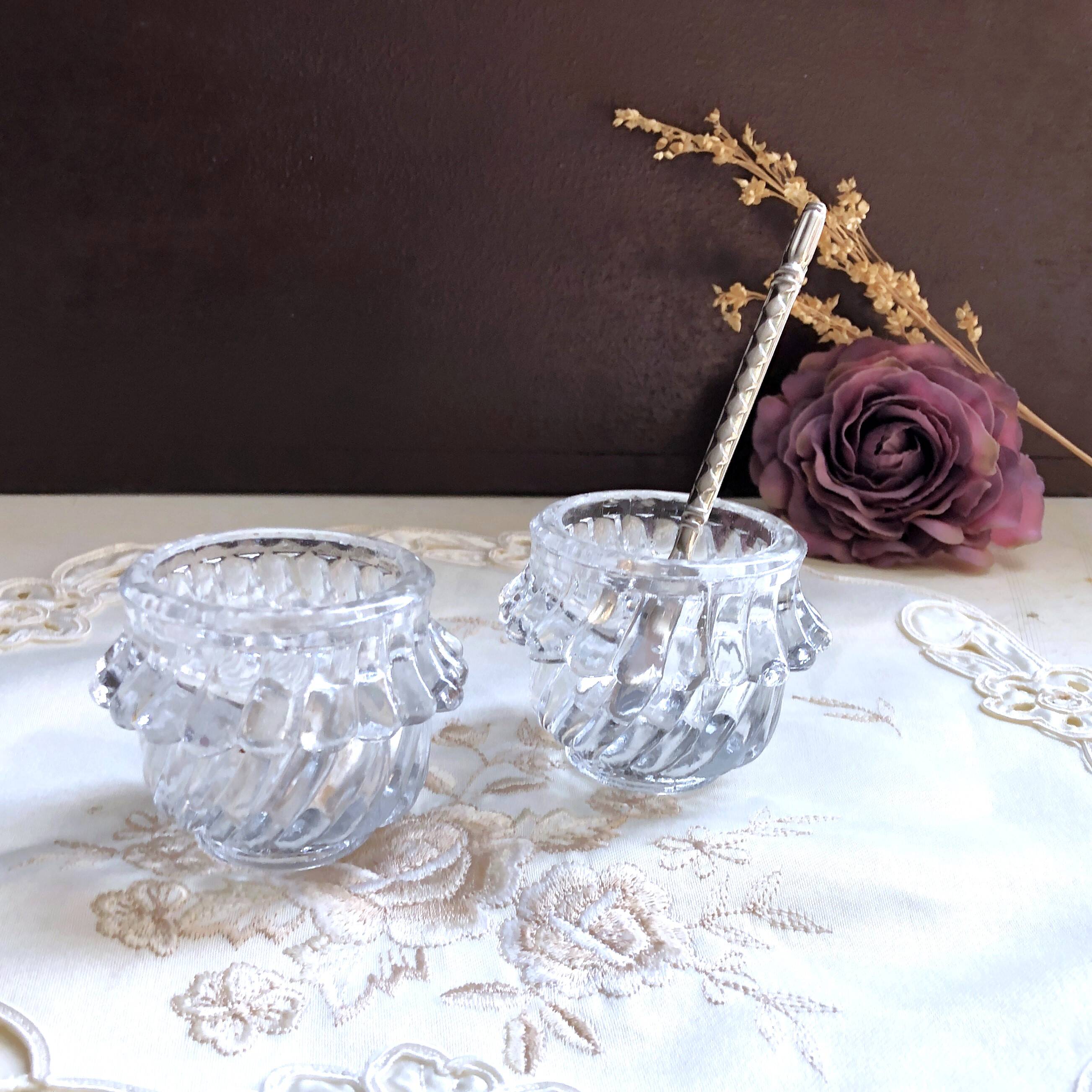 Glass salt and pepper shaker set with vintage serving spoon