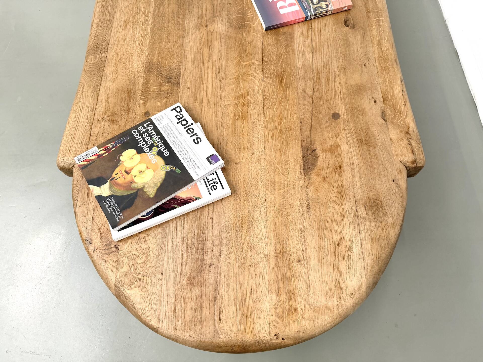 XXL oval coffee table in solid oak, cylindrical base, 1950s.