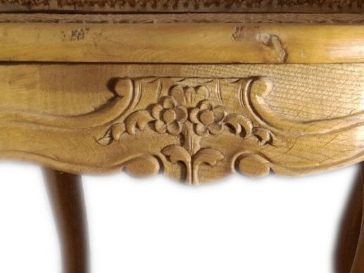 Armchair in solid oak with caning and a central leg (known as couillard), 89x68cm.