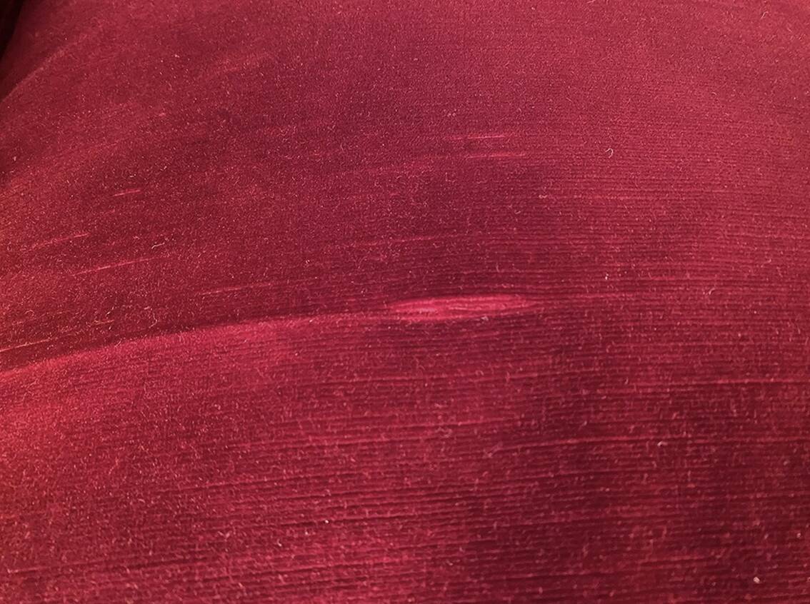 Golden wooden bergère in Louis XVI style upholstered in Bordeaux velvet.