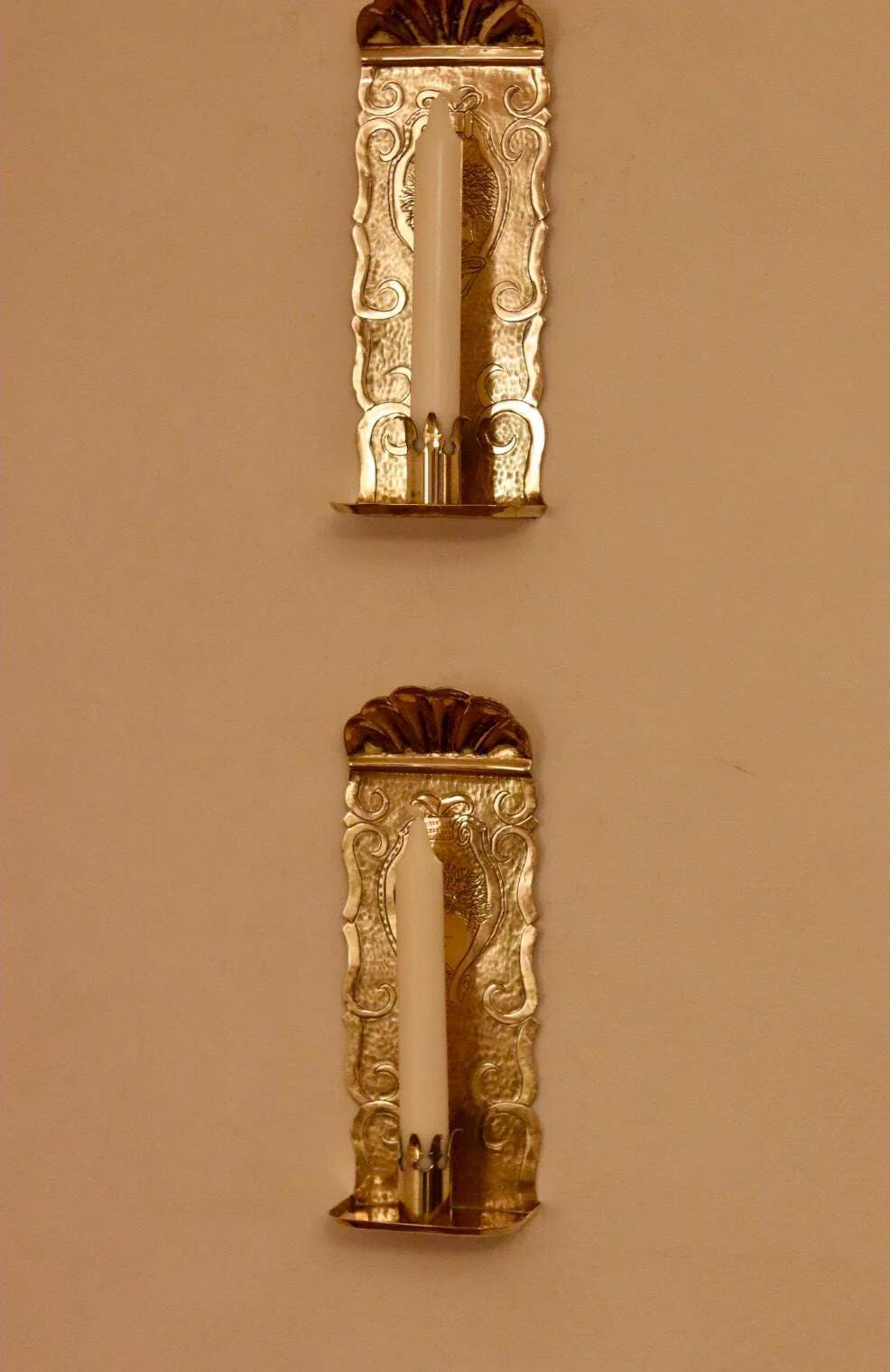 A pair of Swedish brass wall sconces from the mid-century.