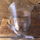 Old pitcher service and 5 foot glasses in engraved glass vintage table art