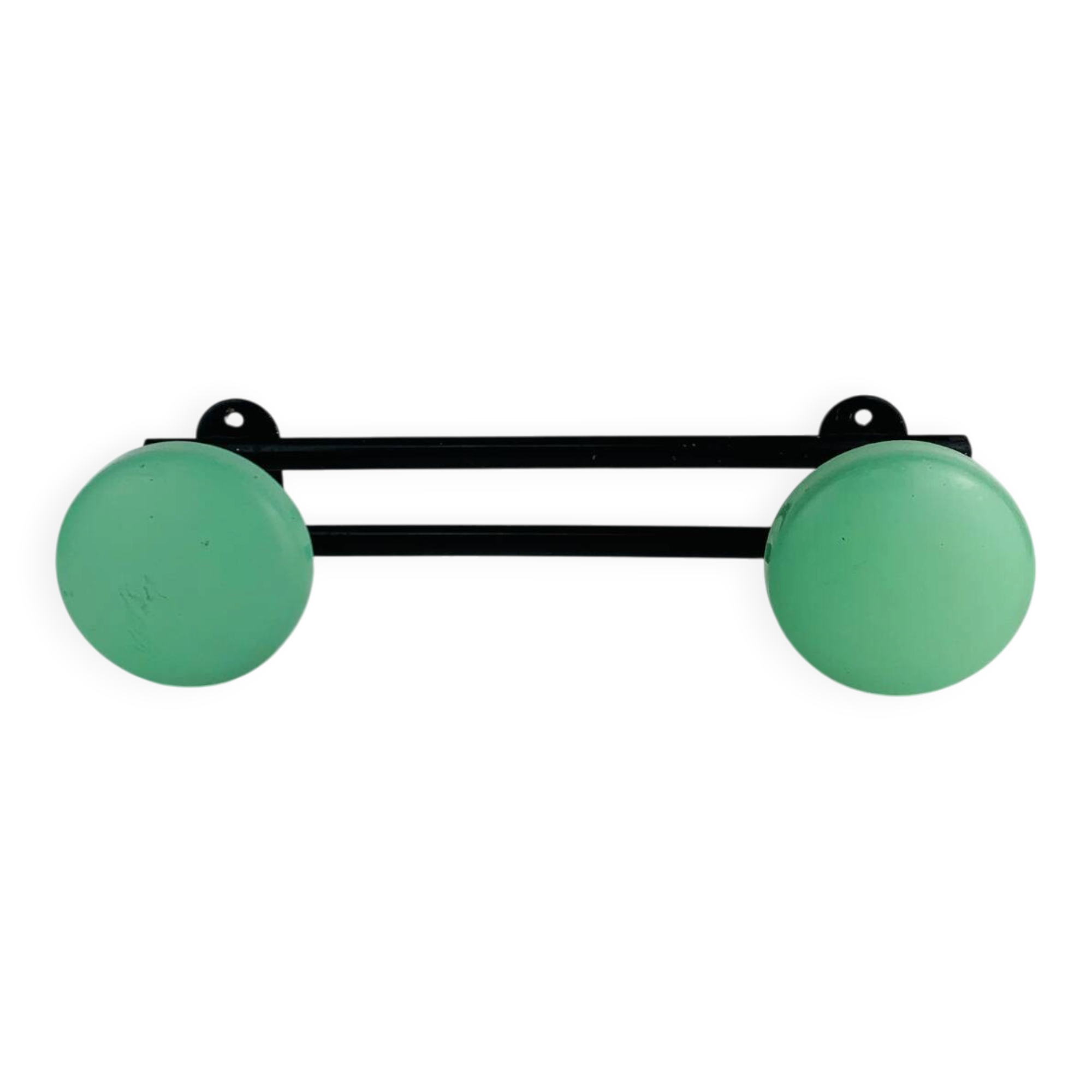Wall-mounted coat rack with 2 green hooks from the 1950s.