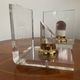 Vintage pair of bookends in lucite and brass from the 1970s.