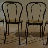 4 Chaises bistrot en métal noir et assise cannage plastique