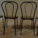 4 Black metal bistro chairs with plastic cane seat