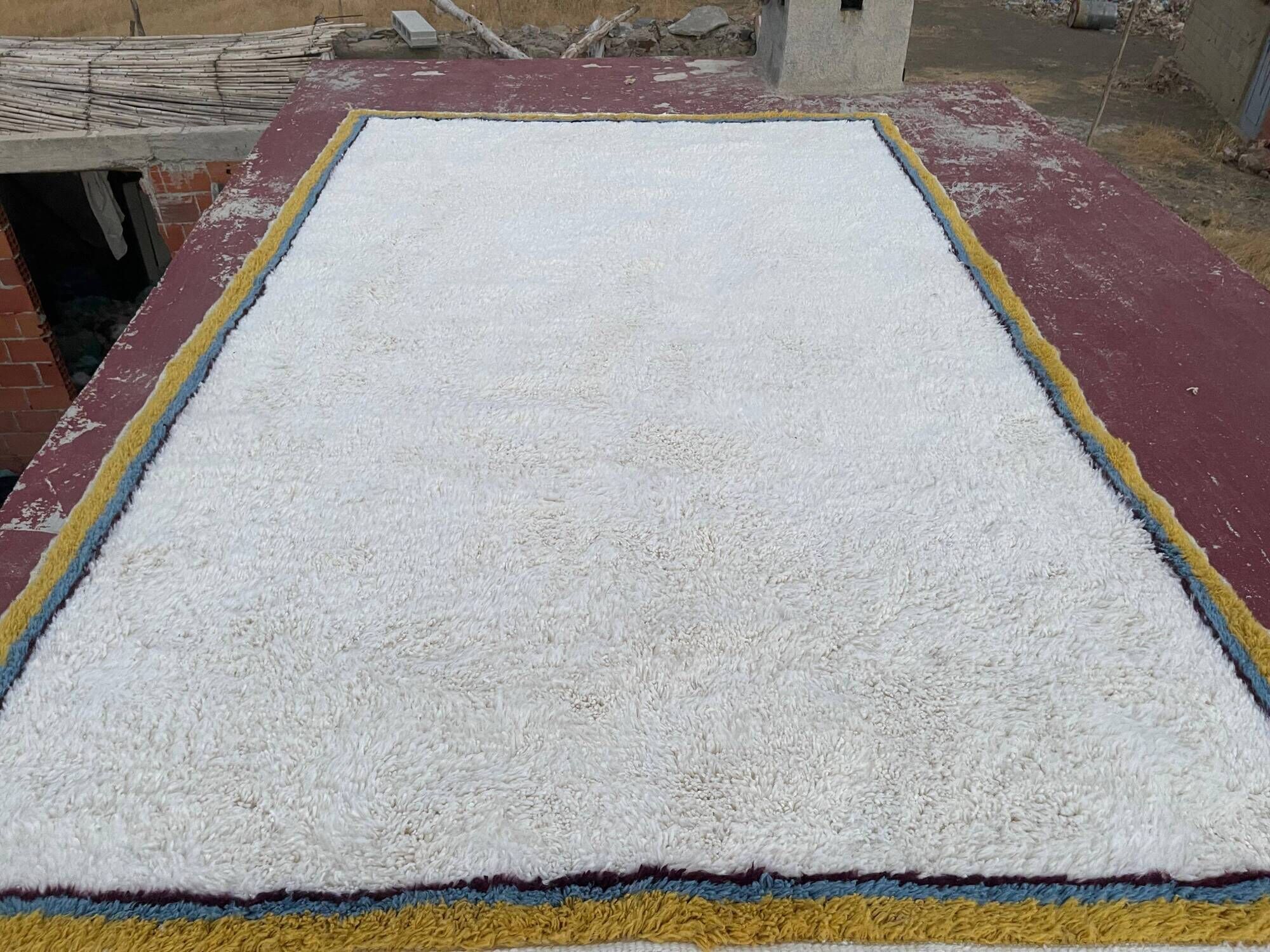 Large Moroccan Berber rug in cream 400x250 cm – yellow and blue border