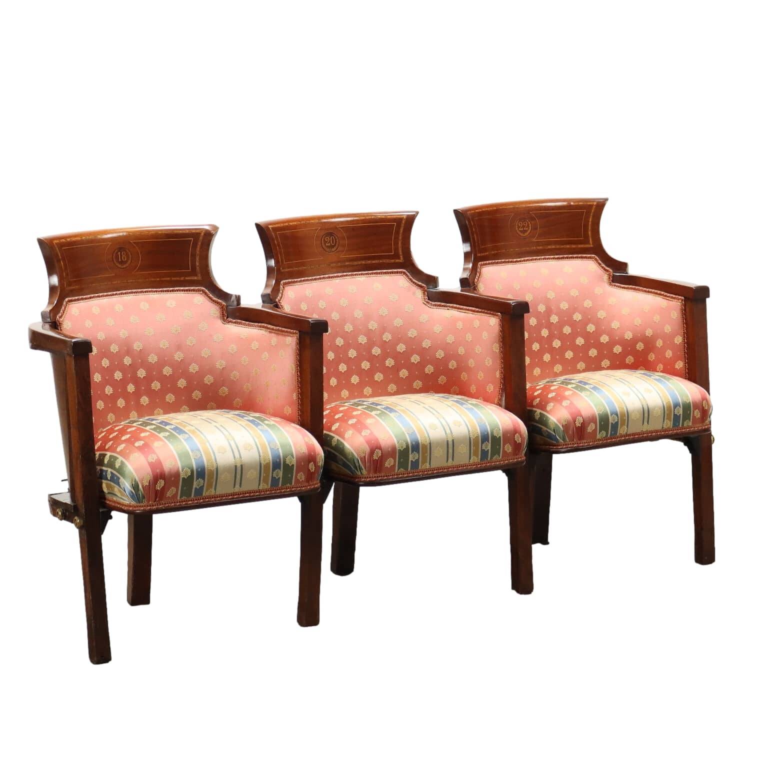 Three vintage cinema or theatre armchairs