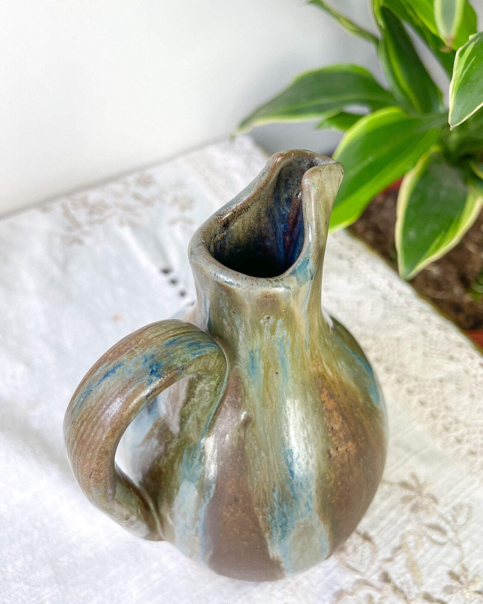 Art Nouveau style carafe in flamed stoneware with blue and brown drips