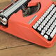Hermès Baby orange typewriter.