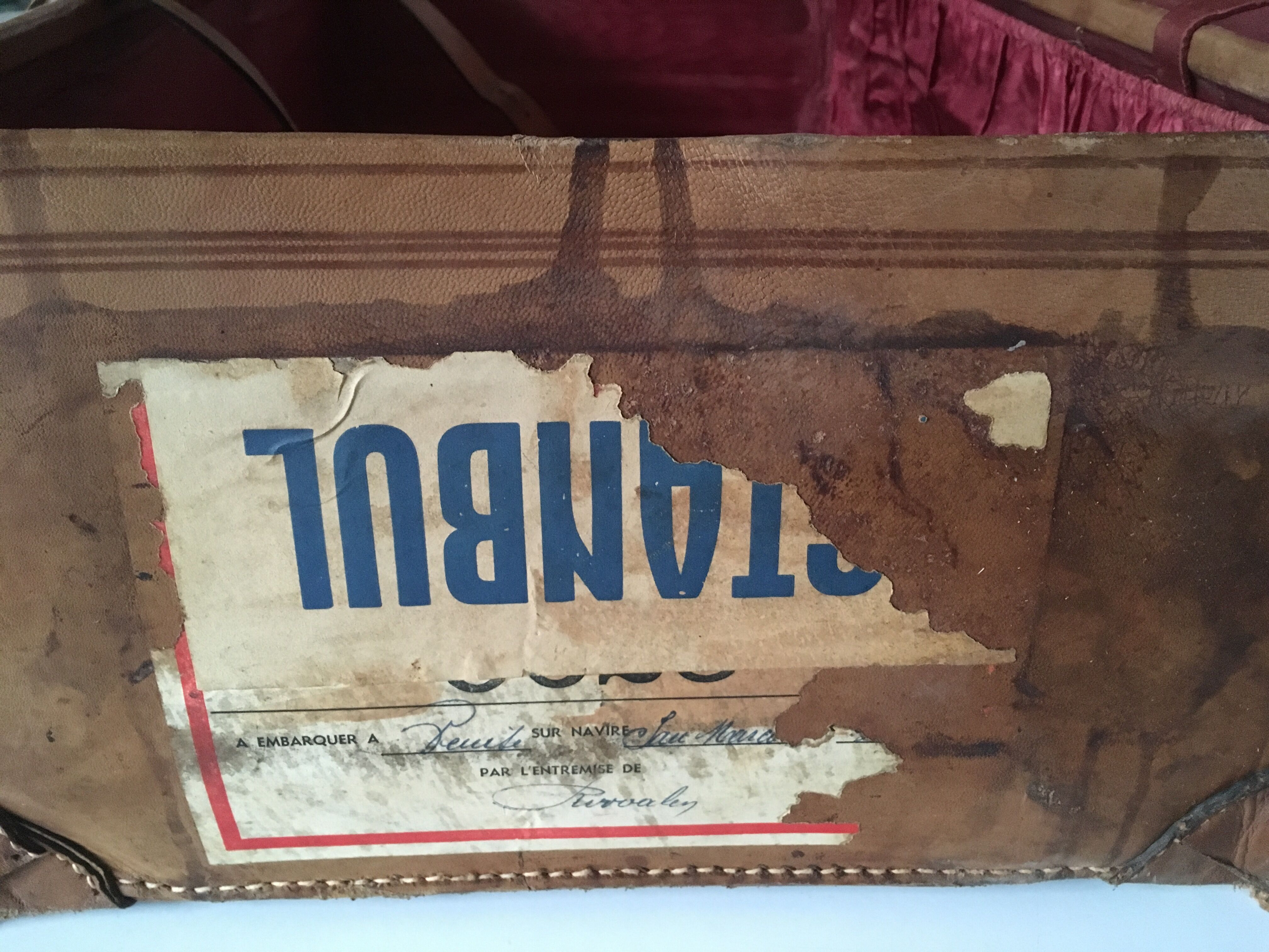 suitcase of leather with labels of palaces