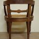 Fauteuil de bureau style Renaissance ancien en bois sculpté et assise cannée