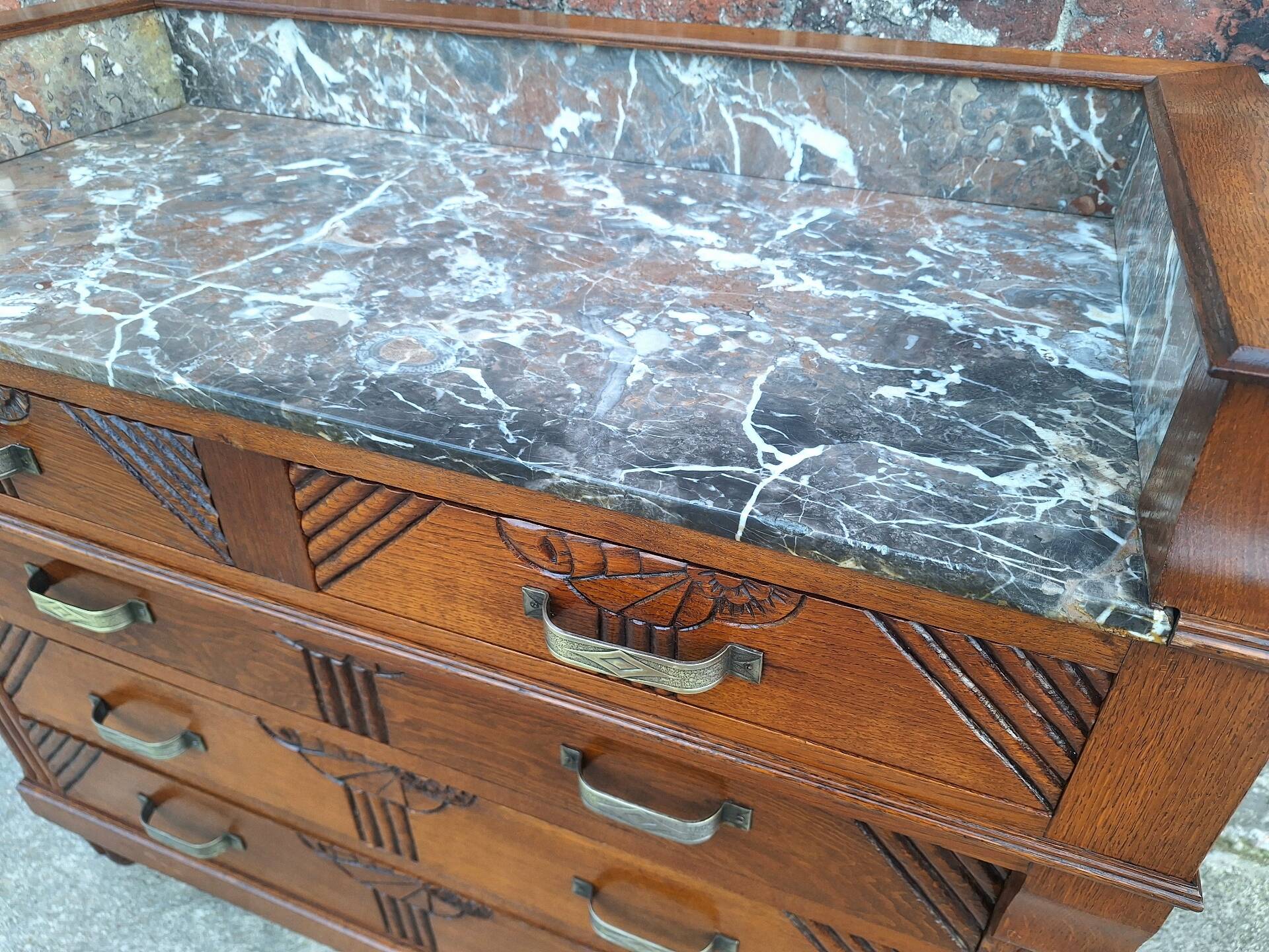 Art Deco commode with marble top, vintage antique furniture.
